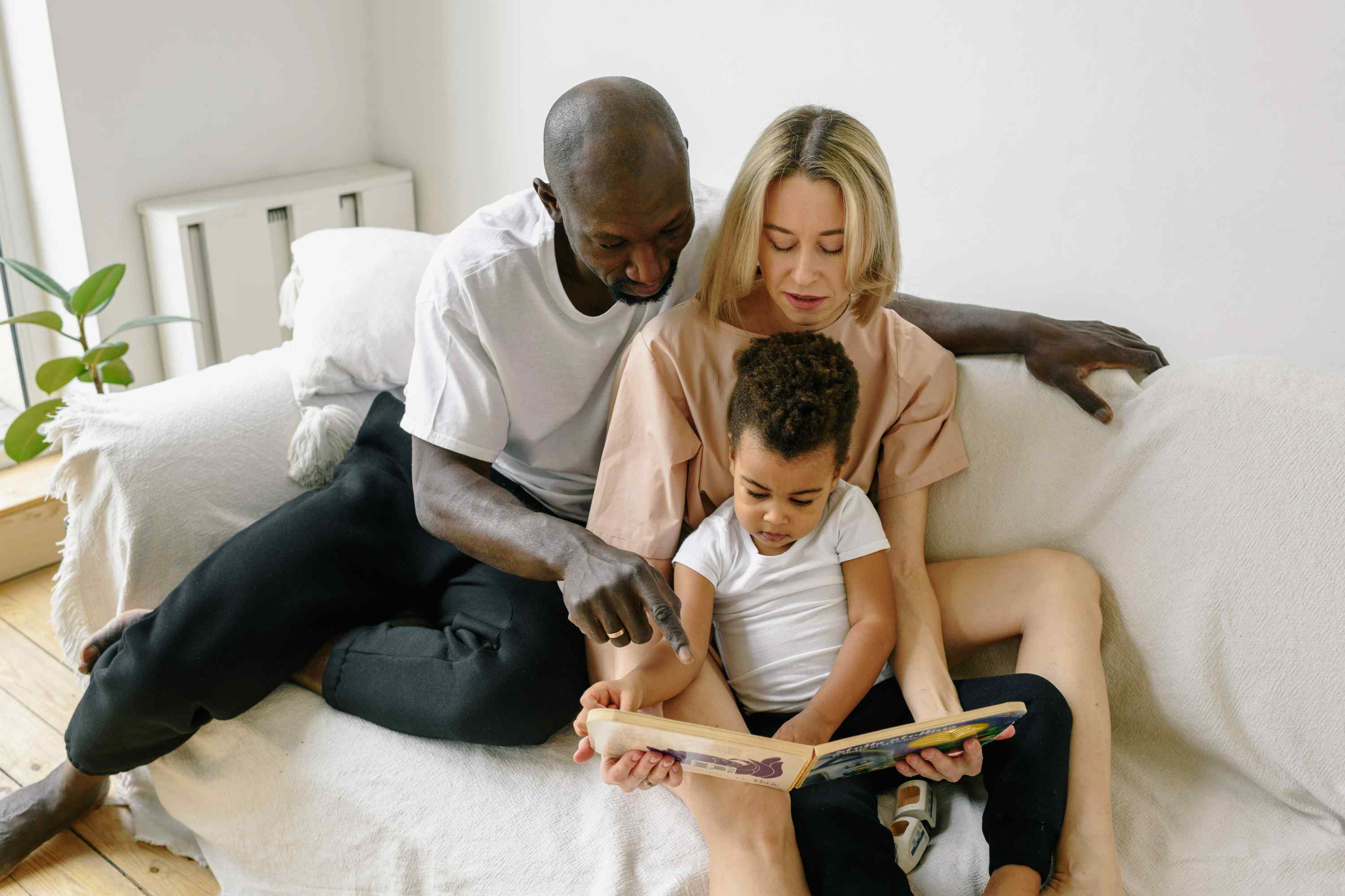 Kids go free family reading a book